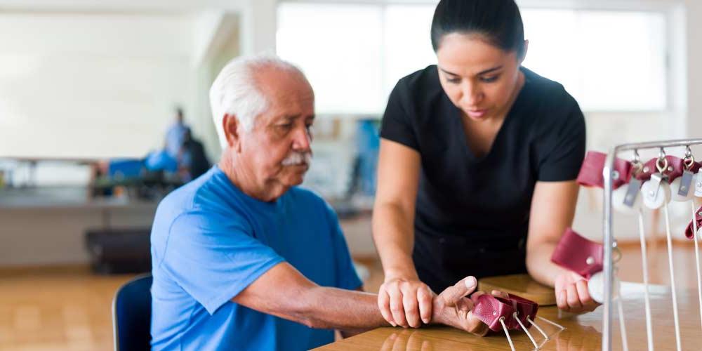 Pre-Occupational Therapy Health Sciences concentration student working with a patient